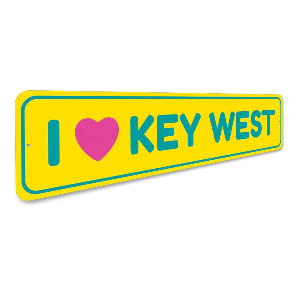 A decorative I Love Key West sign made of high-quality aluminum, featuring vibrant colors and a coastal design, perfect for beach-themed decor.