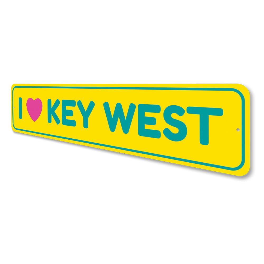 A decorative I Love Key West sign made of high-quality aluminum, featuring vibrant colors and a coastal design, perfect for beach-themed decor.