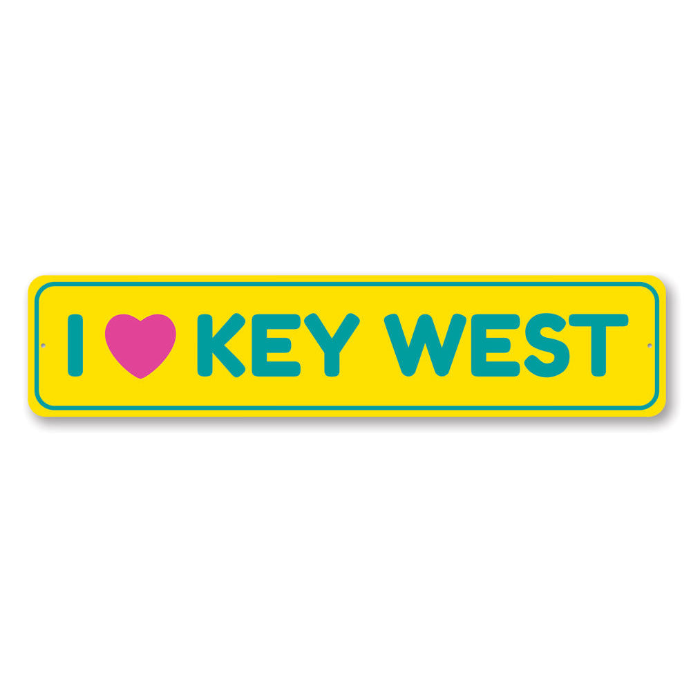 A decorative I Love Key West sign made of high-quality aluminum, featuring vibrant colors and a coastal design, perfect for beach-themed decor.