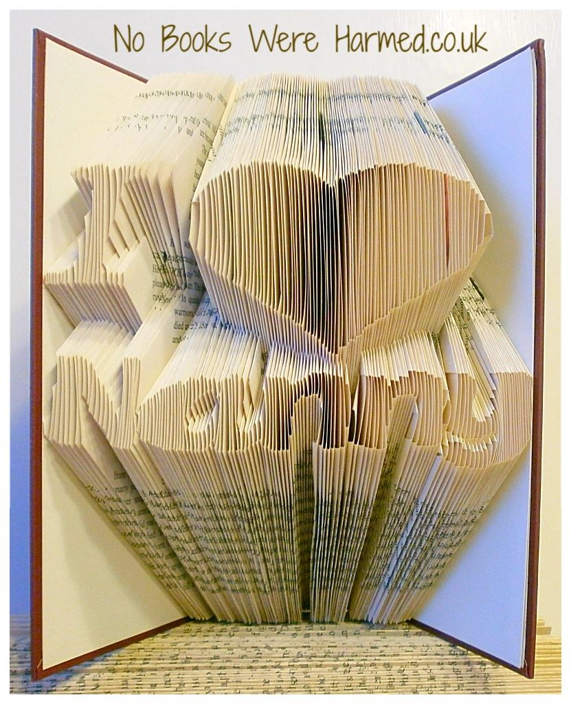 Handcrafted I ♥ Nanny book art made from vintage books, showcasing unique folded pages in various colors.