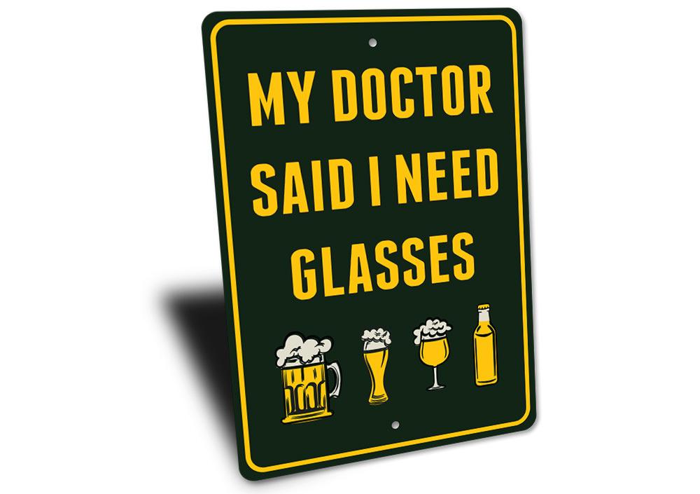 I Need Glasses Beer Sign made of durable aluminum, featuring humorous text and pre-drilled holes for easy mounting.