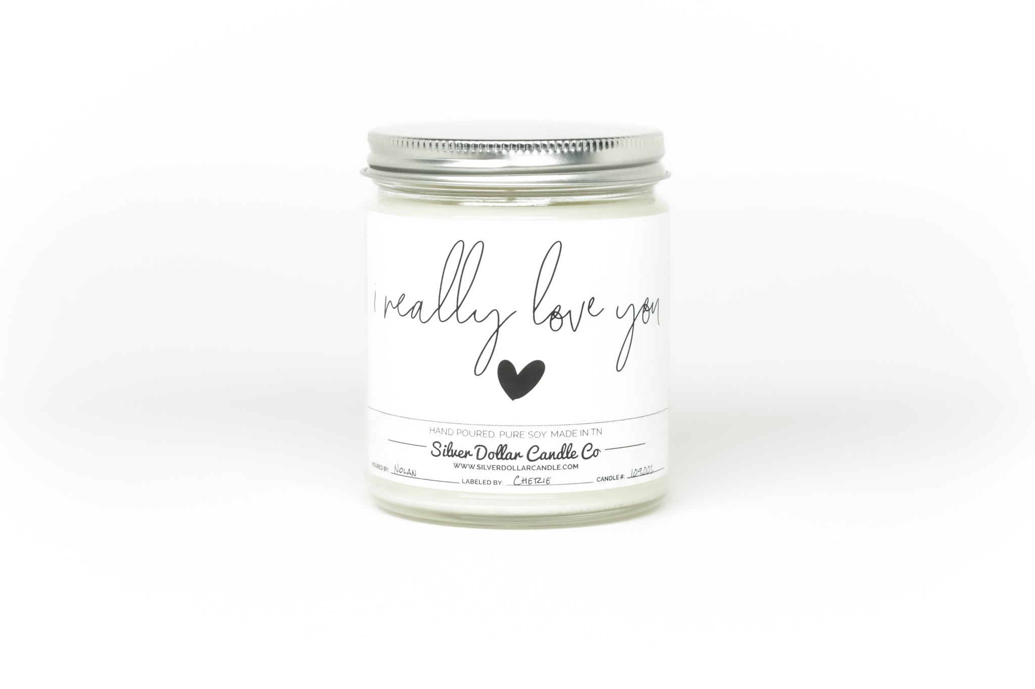 A beautifully designed 'I Really Love You' candle in an elegant box, showcasing its personalization option and scent variety.