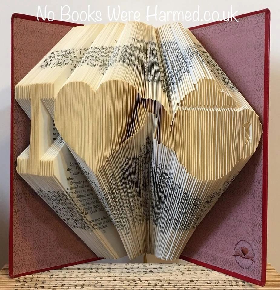 Handcrafted 'I ♥ Tea' Teapot made from vintage book pages, showcasing intricate hand-folded design.