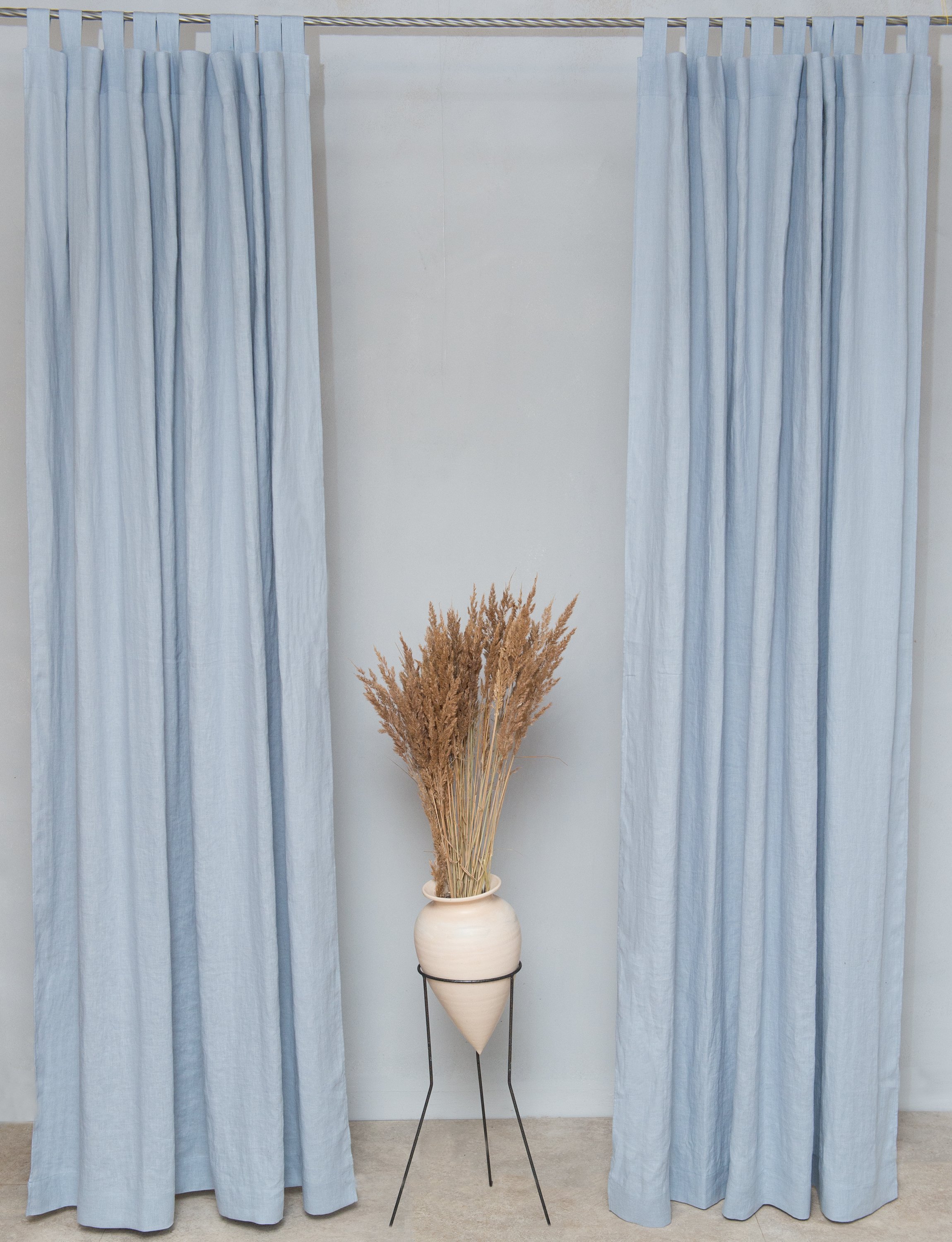 Ice Blue linen curtain with tab tops, showcasing a semi-sheer fabric that allows light to filter through elegantly.