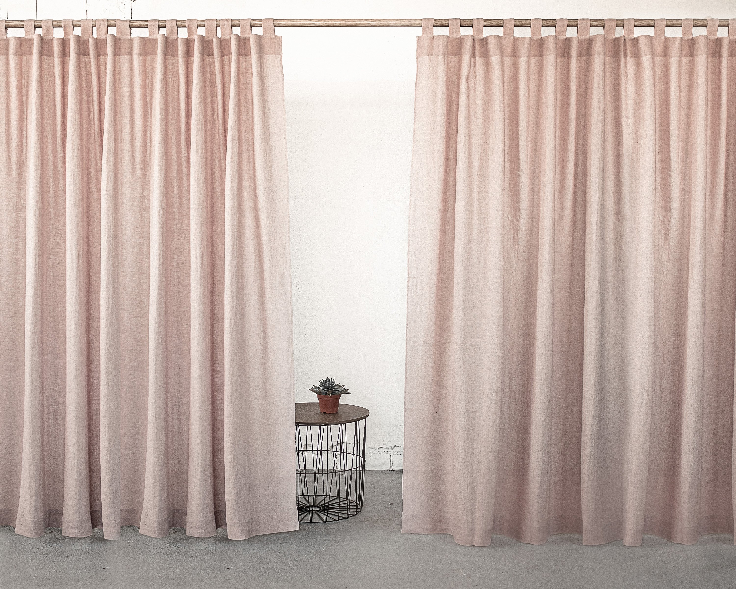 Ice Blue linen curtain with tab tops, showcasing a semi-sheer fabric that allows light to filter through elegantly.