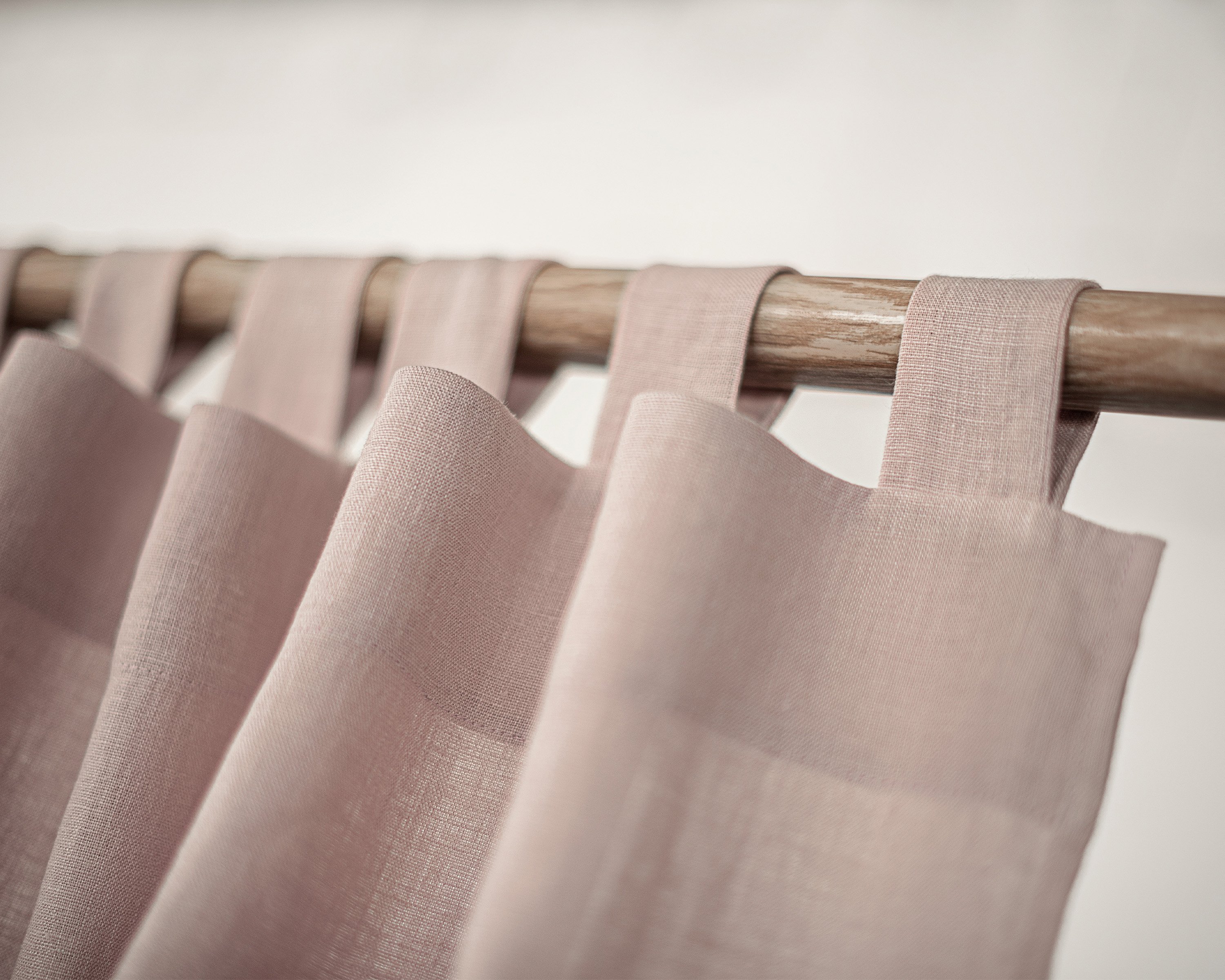 Ice Blue linen curtain with tab tops, showcasing a semi-sheer fabric that allows light to filter through elegantly.