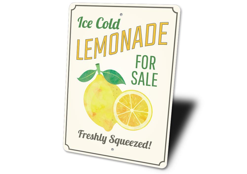 A vibrant Ice Cold Lemonade Sign made of aluminum, featuring bright colors and a refreshing lemonade design, perfect for cafes and restaurants.