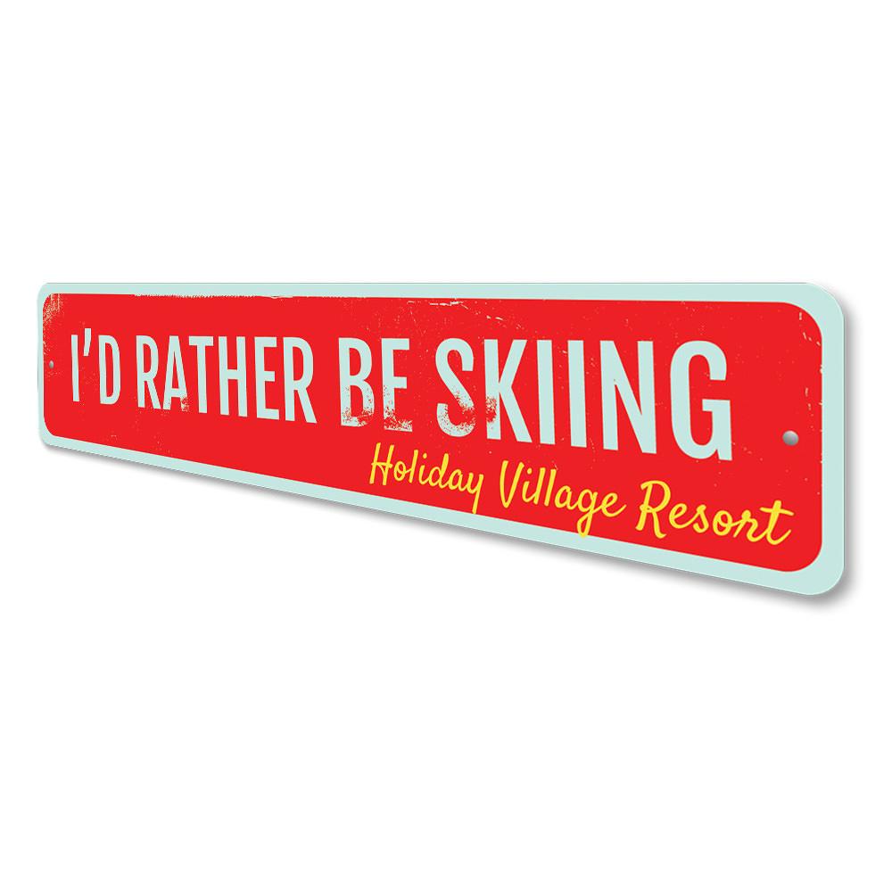 A decorative metal sign that reads 'I'd Rather Be Skiing', featuring a stylish design perfect for ski enthusiasts.