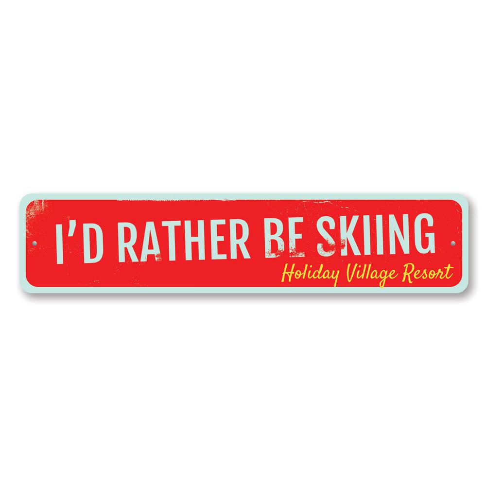 A decorative metal sign that reads 'I'd Rather Be Skiing', featuring a stylish design perfect for ski enthusiasts.