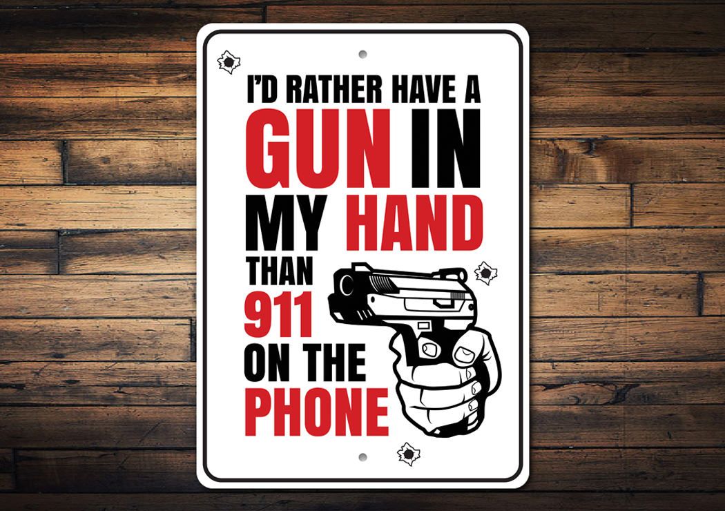 A decorative aluminum sign reading 'I'd Rather Have a Gun in my Hand Than 911 on the Phone', showcasing bold lettering and a stylish design.