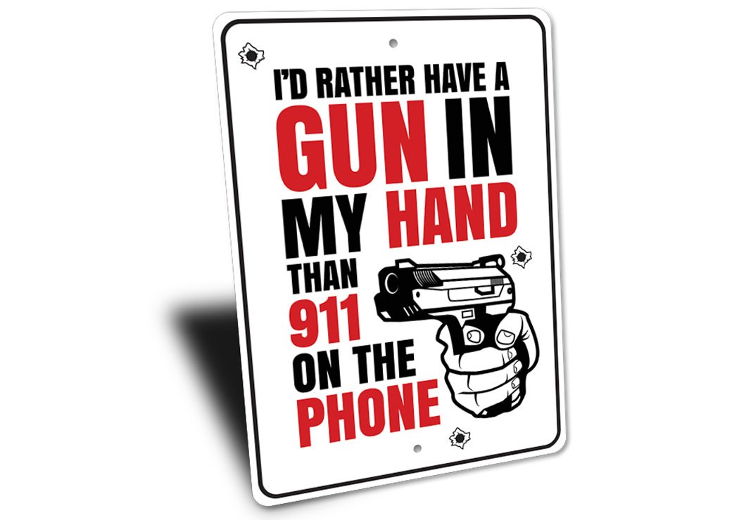 A decorative aluminum sign reading 'I'd Rather Have a Gun in my Hand Than 911 on the Phone', showcasing bold lettering and a stylish design.