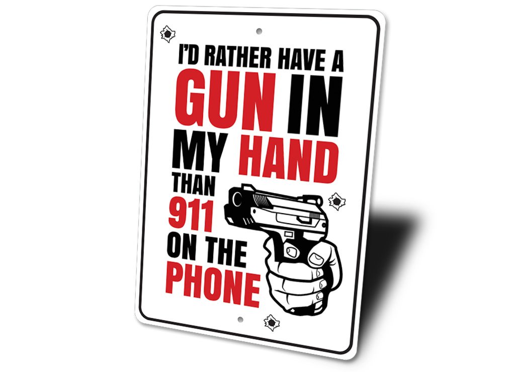 A decorative aluminum sign reading 'I'd Rather Have a Gun in my Hand Than 911 on the Phone', showcasing bold lettering and a stylish design.