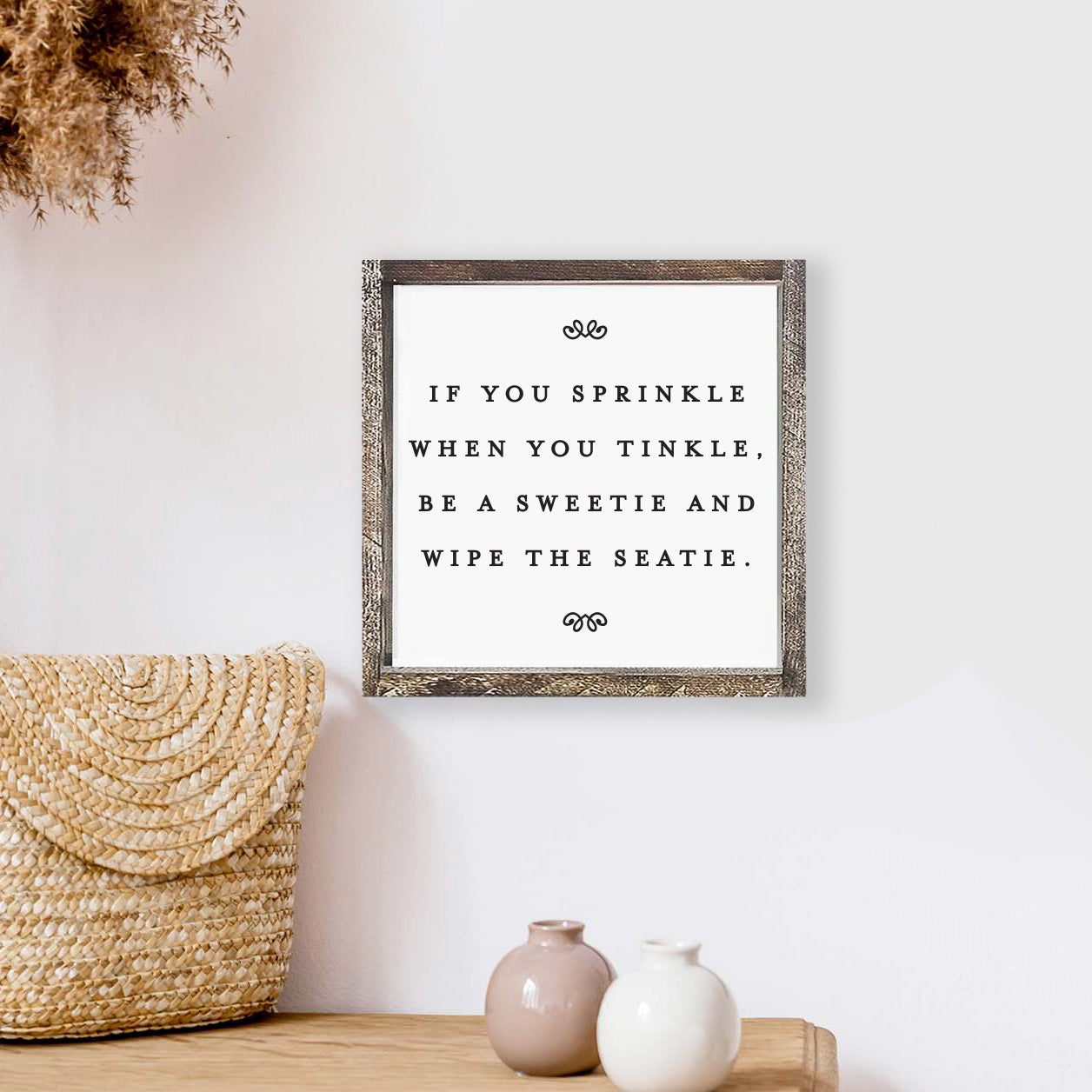 A humorous wooden sign reading 'If You Sprinkle When You Tinkle', framed in stained pine wood, perfect for bathroom decor.