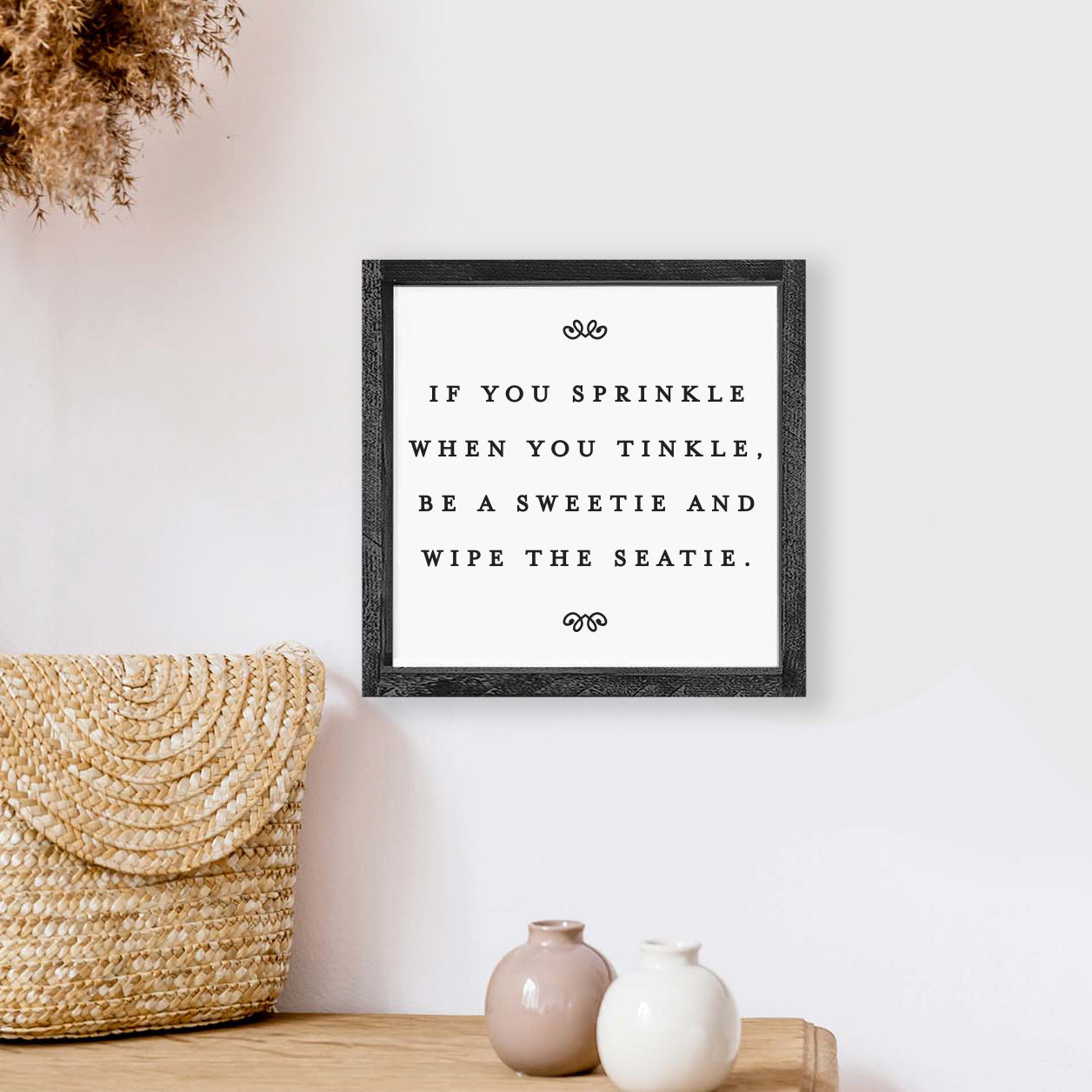 A humorous wooden sign reading 'If You Sprinkle When You Tinkle', framed in stained pine wood, perfect for bathroom decor.