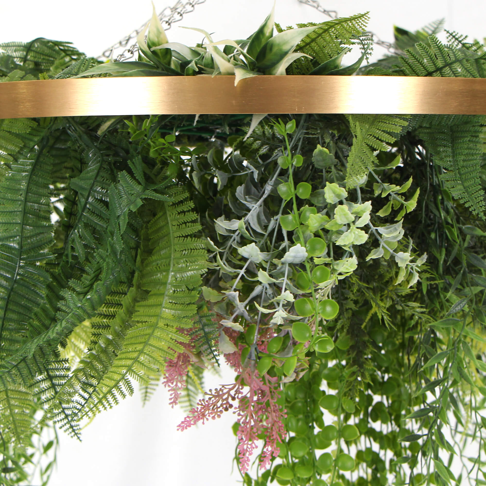 A 60cm imitation gold artificial hanging green wall disc, showcasing vibrant greenery and a stylish design, perfect for indoor decoration.