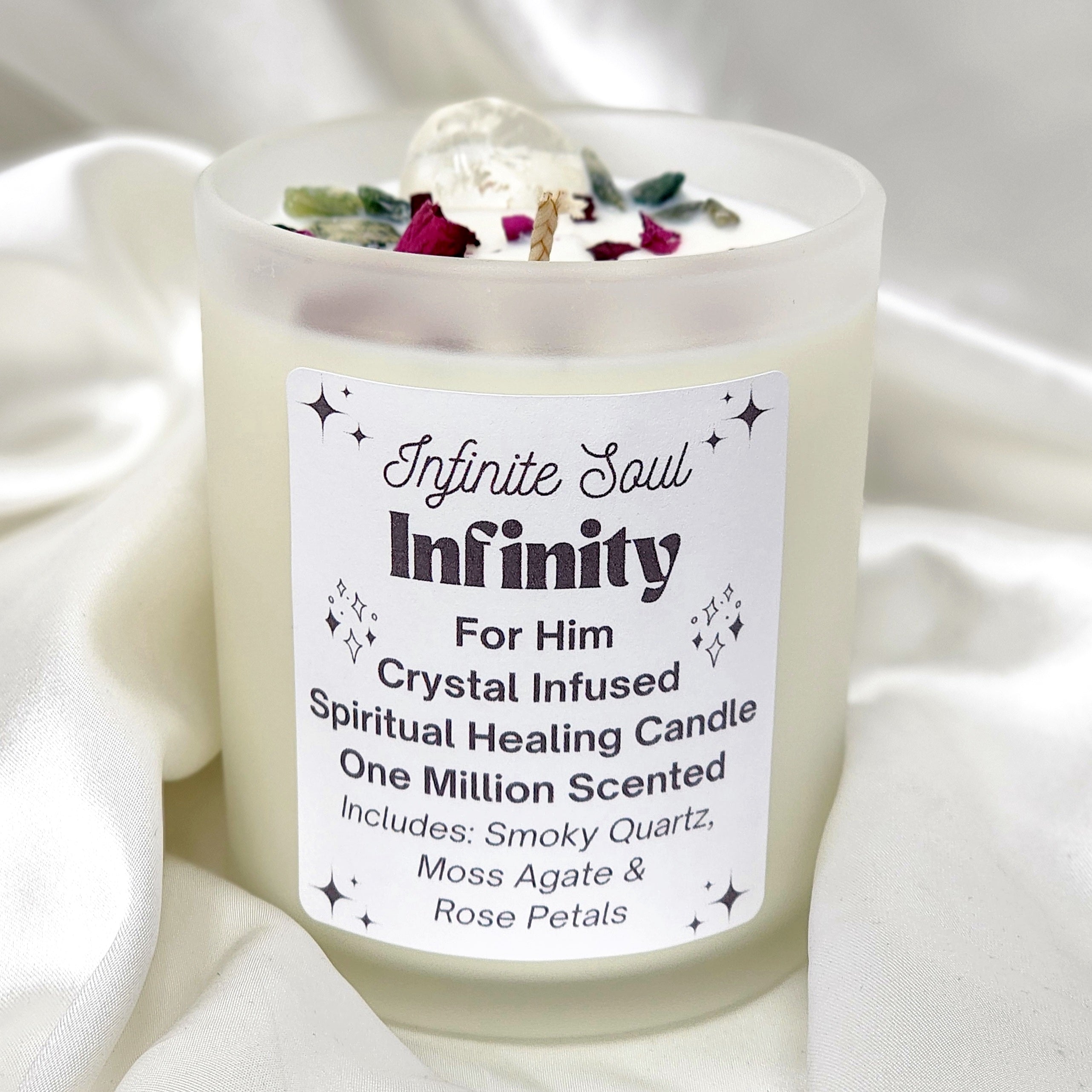 Infinity: For Him Crystal Infused Candle with Smoky Quartz, Moss Agate, and Rose Petals in a clear jar, emitting a warm glow.