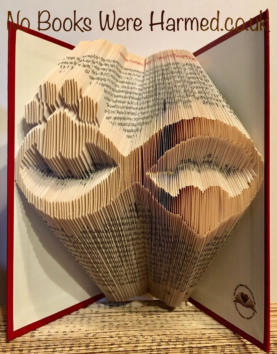 Handcrafted Infinity Heart and Paw Print art made from vintage book pages, showcasing intricate folds and unique design.