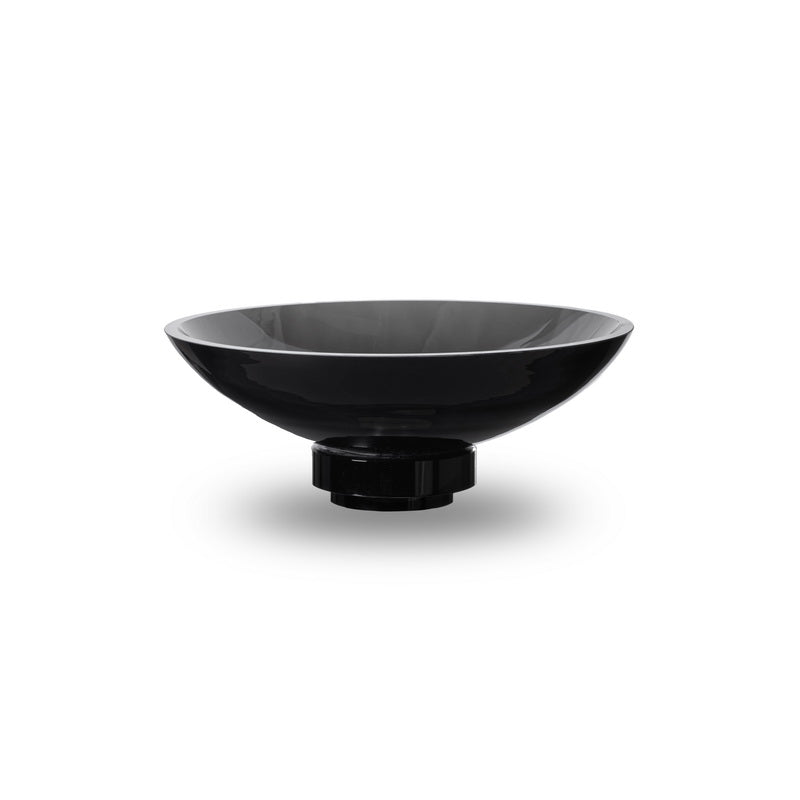 A beautifully crafted innovative design bowl made of deep dark glass, showcasing modern aesthetics and exceptional craftsmanship.