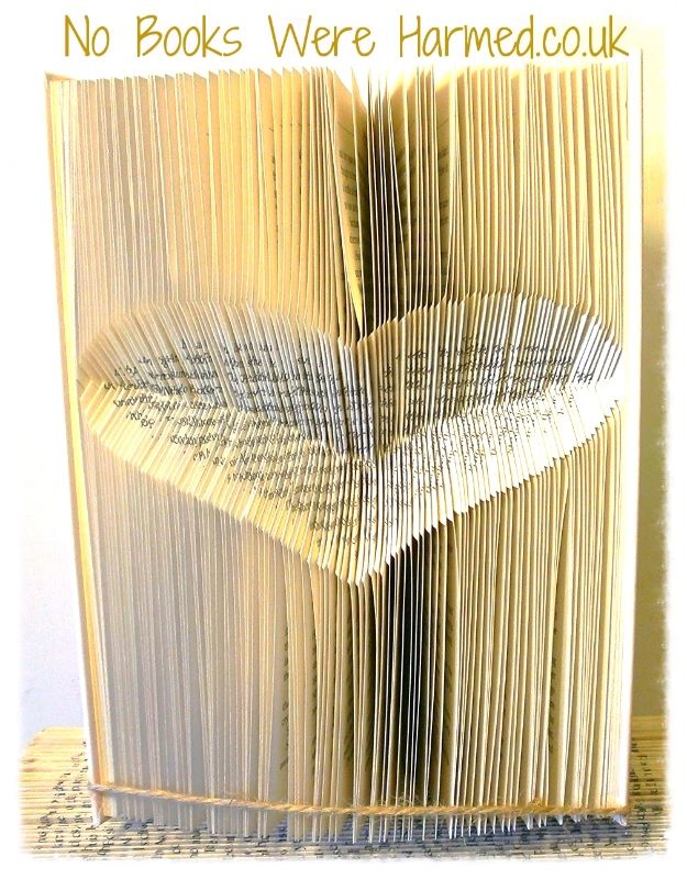 Handcrafted Inverted Love Heart art made from vintage book pages, showcasing intricate folds and unique design.