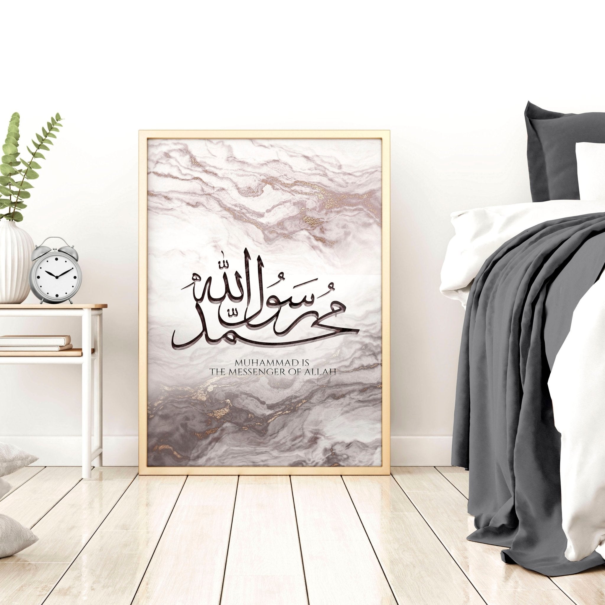 A beautiful Islamic wall art print featuring rose gold Arabic calligraphy on a maroon and muted pink abstract marble background.