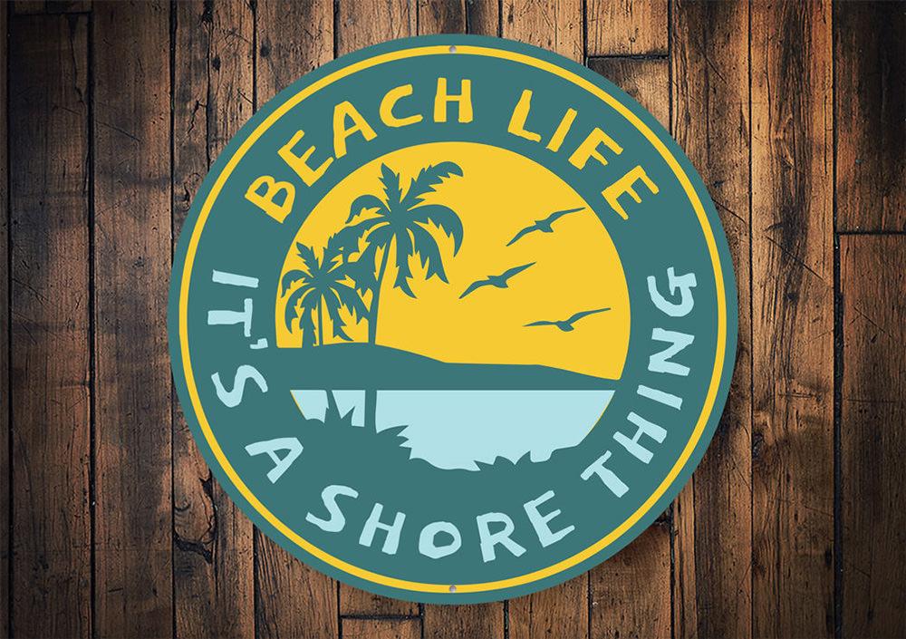 It's a Shore Thing Beach Sign made of high-quality aluminum, featuring a coastal design perfect for beach houses and outdoor decor.