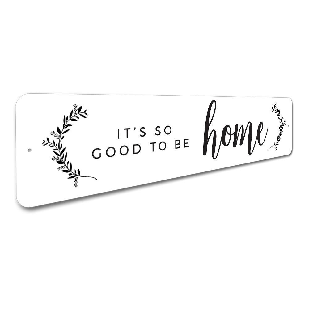 A decorative metal sign reading 'It's So Good To Be Home', showcasing quality aluminum craftsmanship and customizable options.