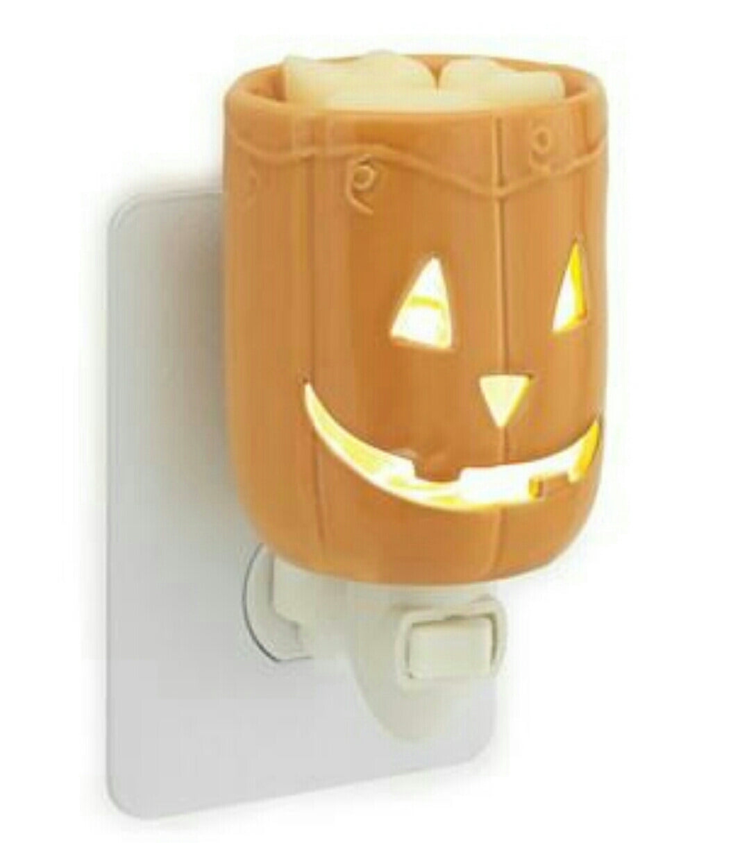 Jack O Lantern Pluggable Warmer with a festive pumpkin design, perfect for Halloween decor.