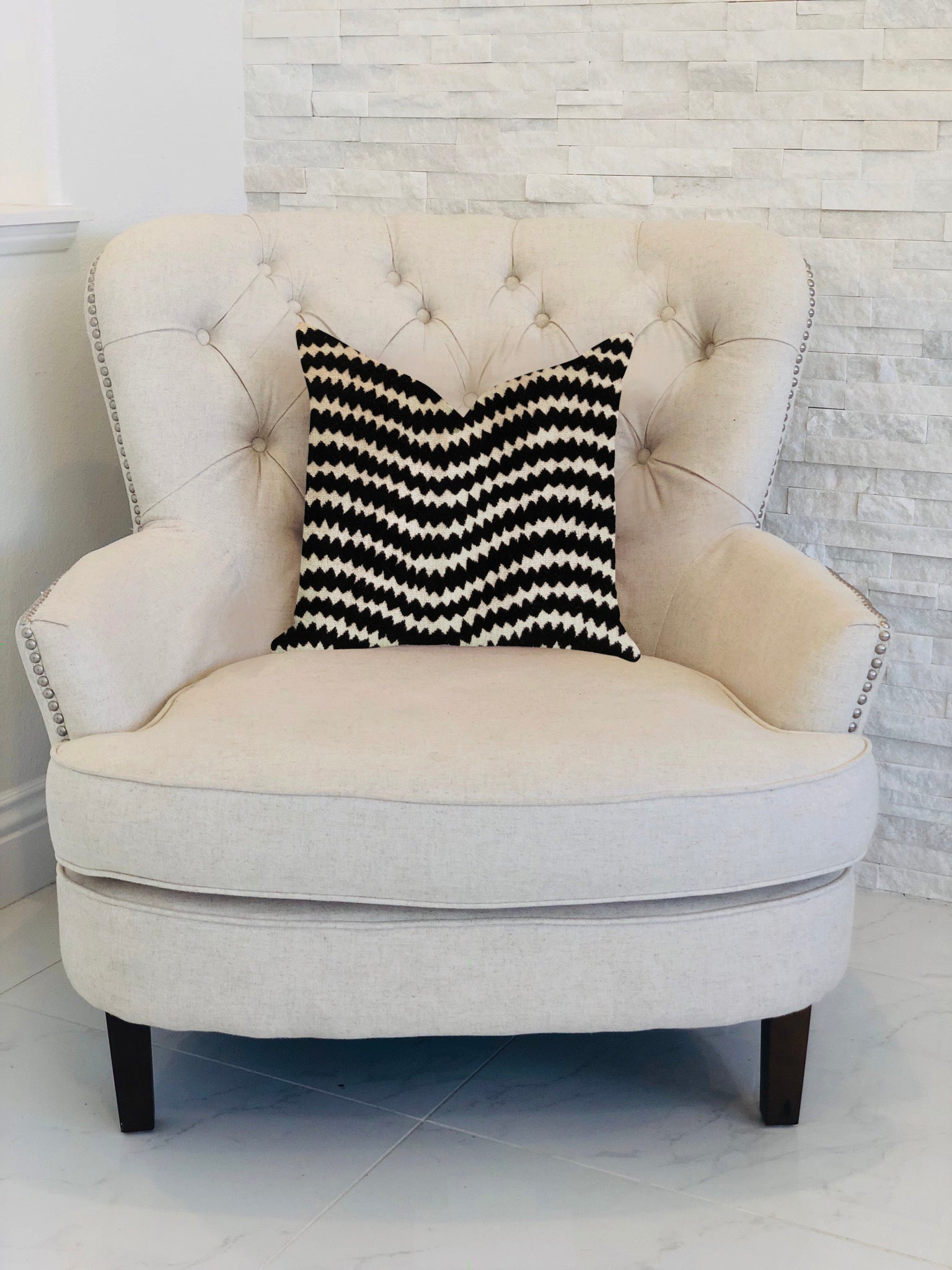 Jagged Fringe Luxury Throw Pillow in Black and Beige, showcasing elegant fringe detailing and a stylish design.