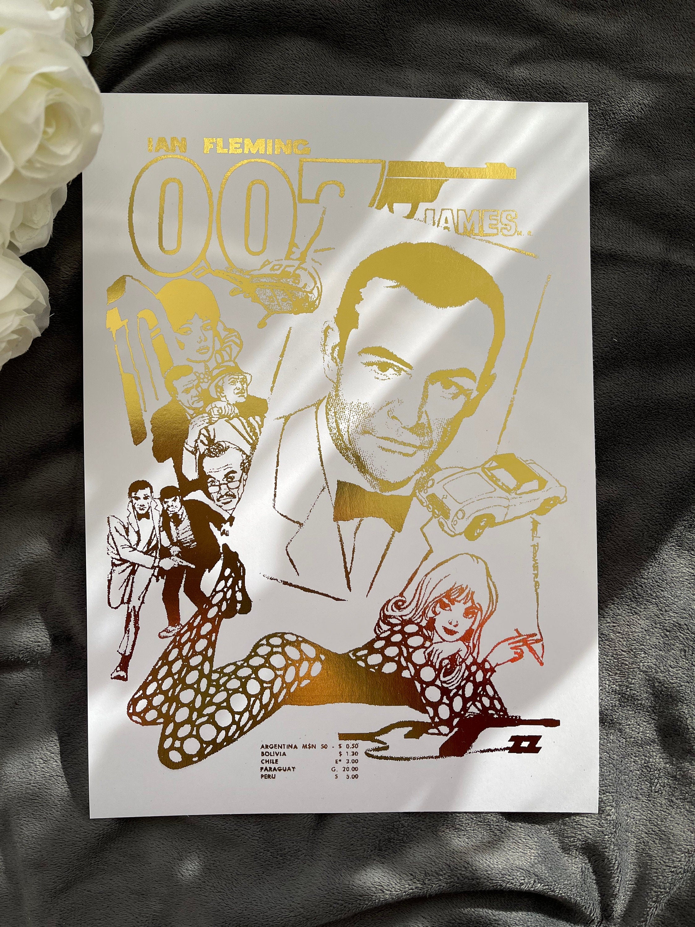 James Bond Foil Print featuring a comic cover with gold foil accents, showcasing the iconic spy in a vibrant design.