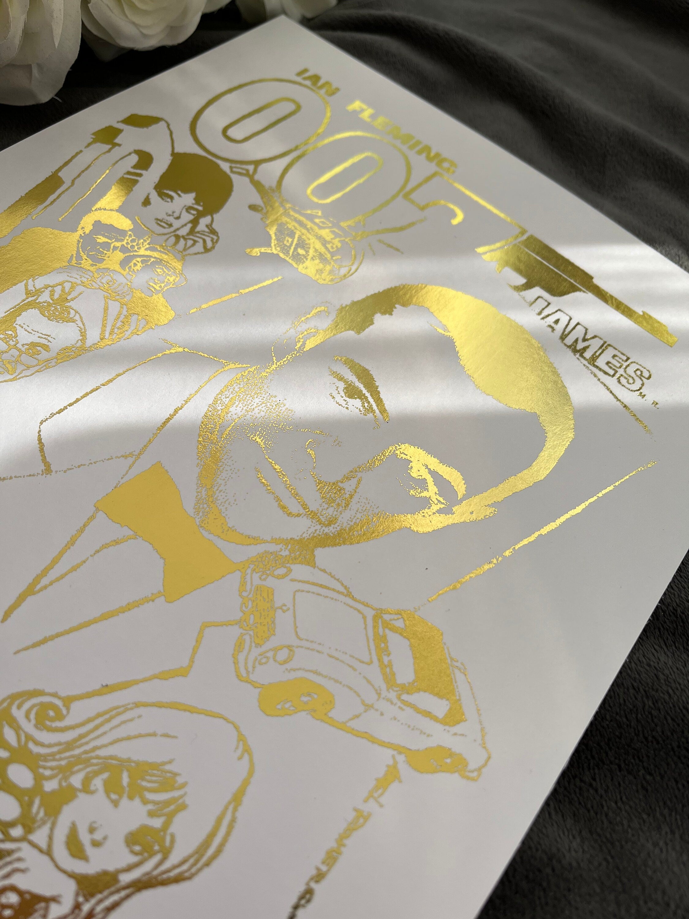 James Bond Foil Print featuring a comic cover with gold foil accents, showcasing the iconic spy in a vibrant design.