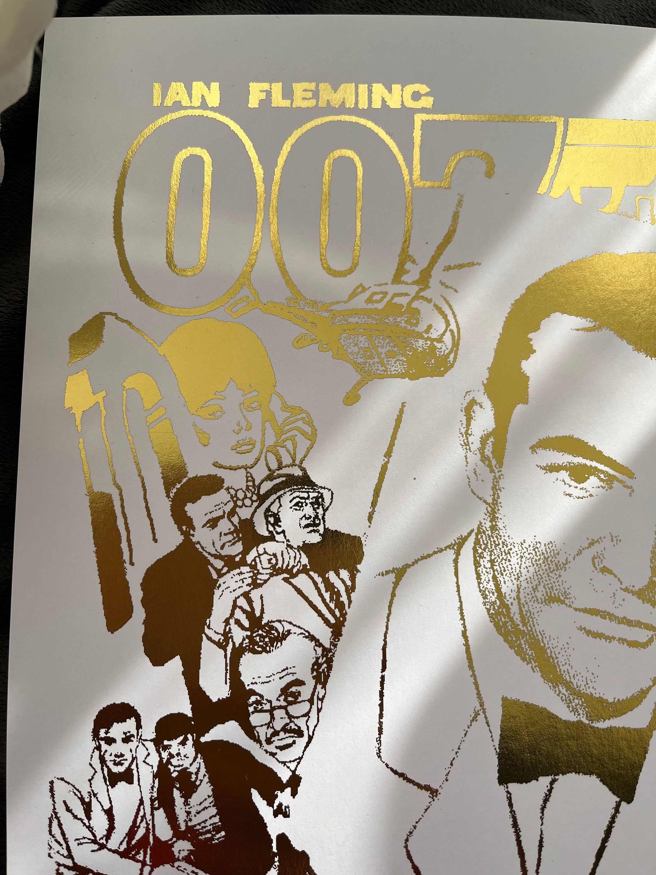 James Bond Foil Print featuring a comic cover with gold foil accents, showcasing the iconic spy in a vibrant design.