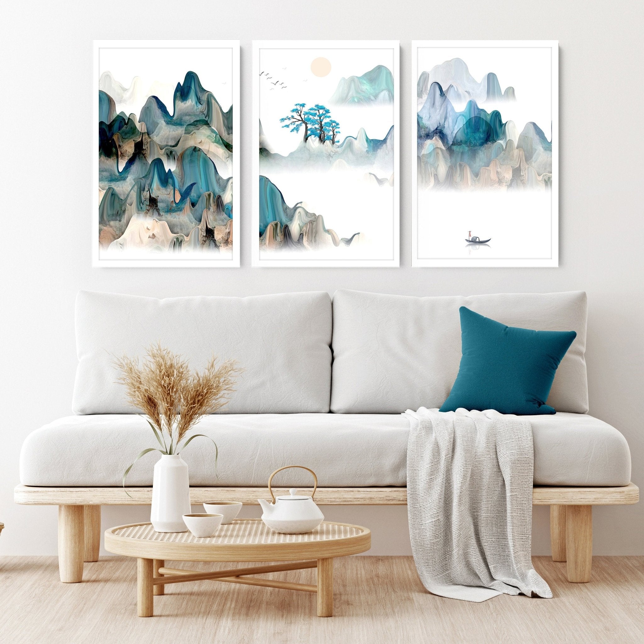 A serene set of three Japanese wall art prints featuring tranquil sunrise landscapes in teal and beige hues, perfect for living room decor.