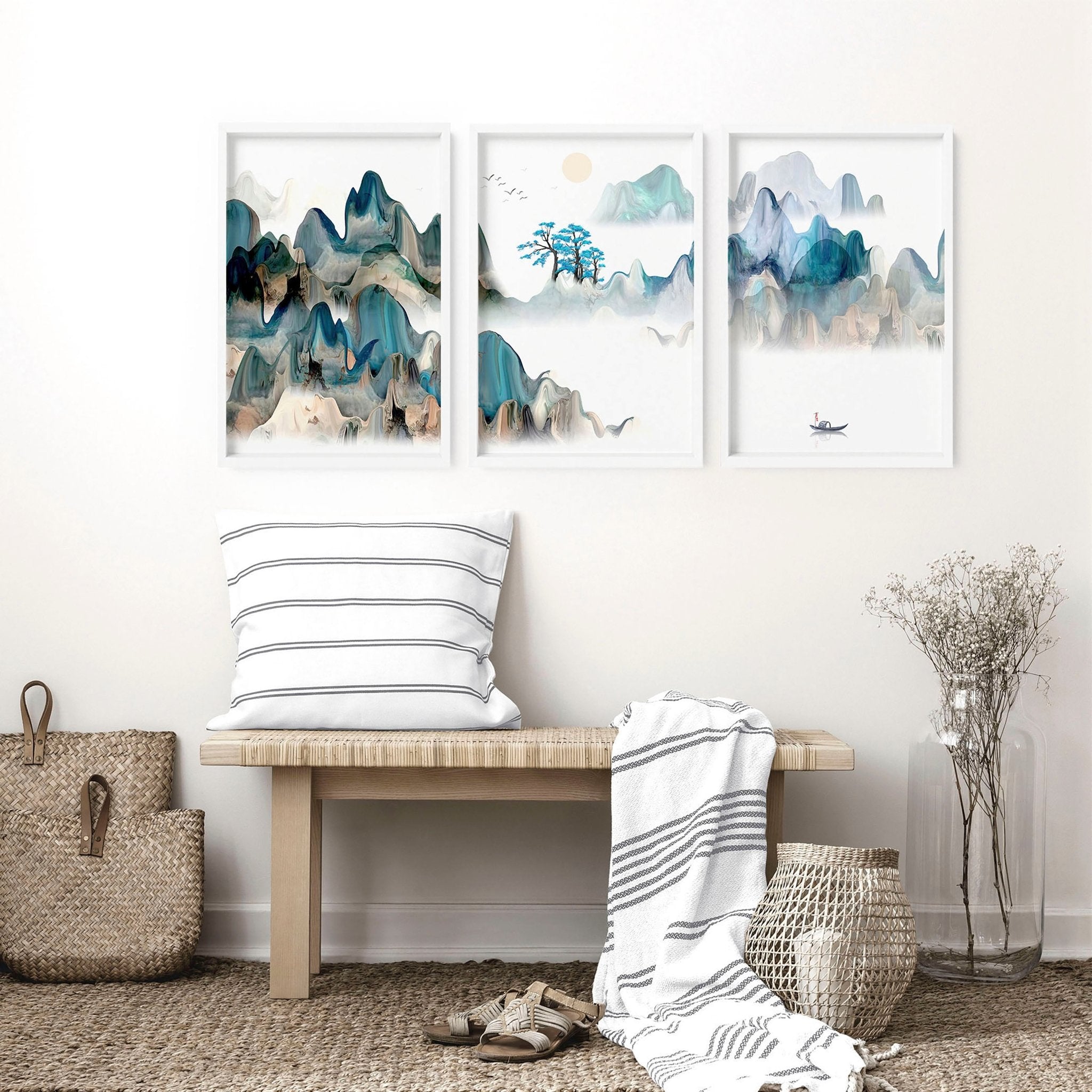 A serene set of three Japanese wall art prints featuring tranquil sunrise landscapes in teal and beige hues, perfect for living room decor.