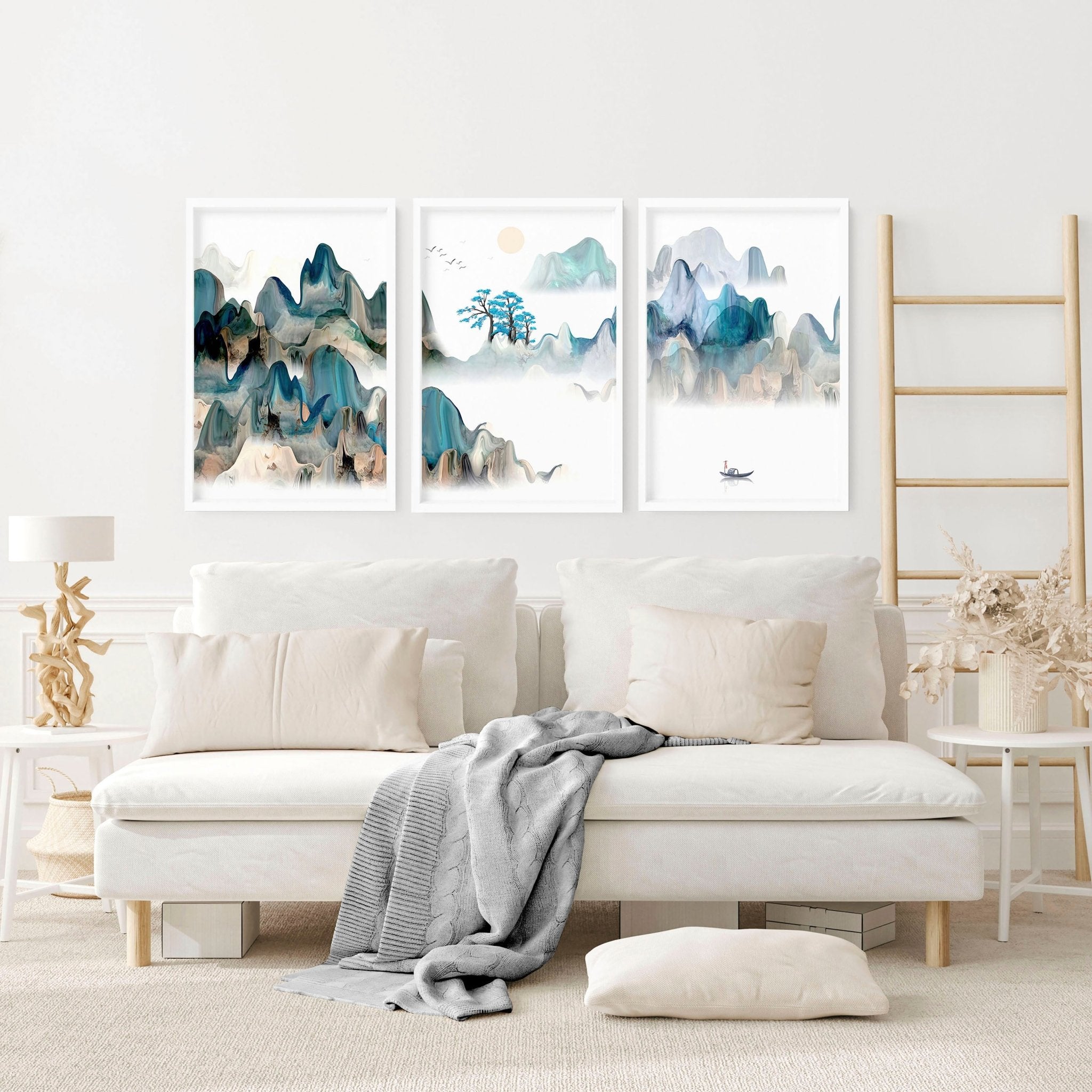 A serene set of three Japanese wall art prints featuring tranquil sunrise landscapes in teal and beige hues, perfect for living room decor.