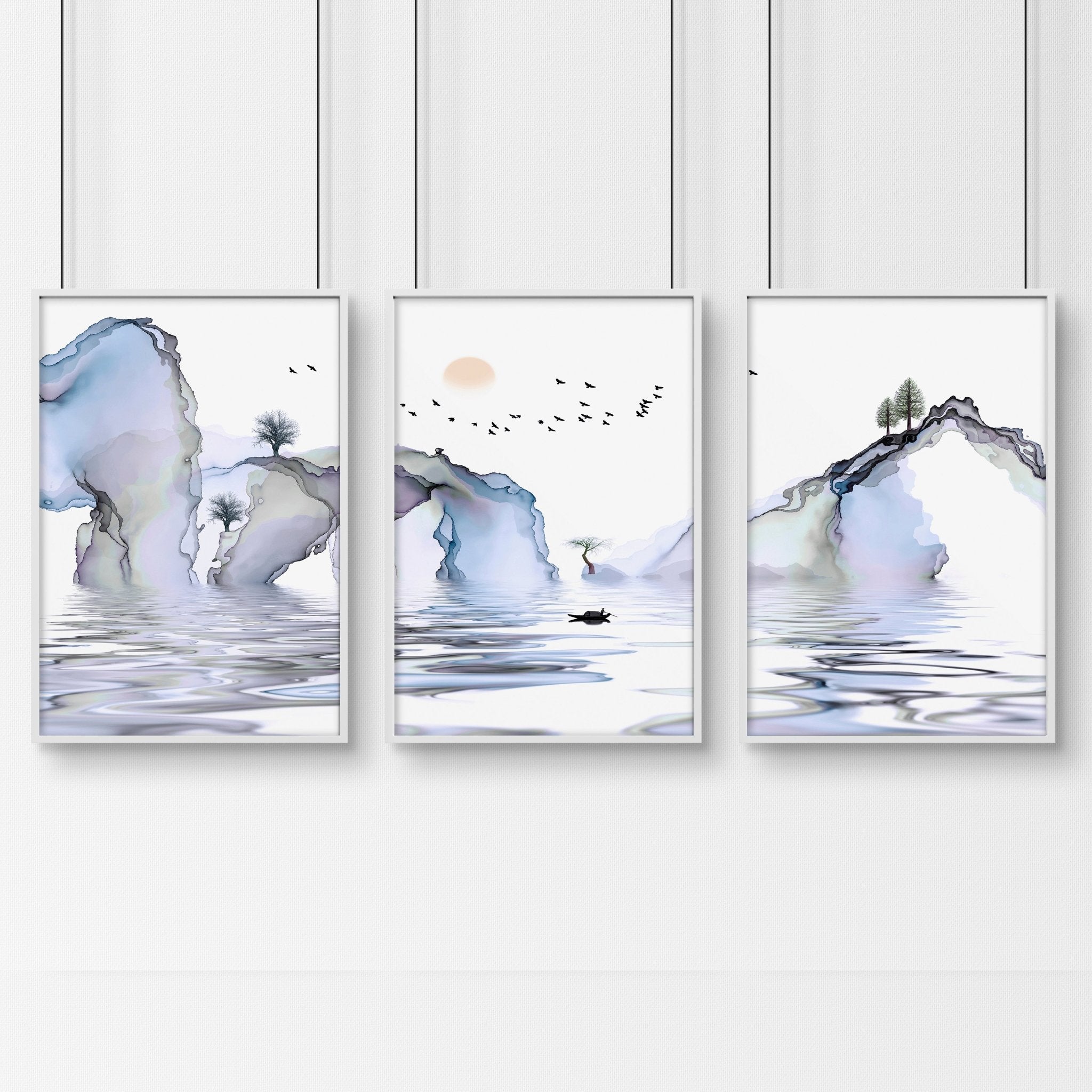 Set of 3 framed wall art prints featuring light blue ethereal Japanese landscapes, perfect for creating a serene bedroom atmosphere.