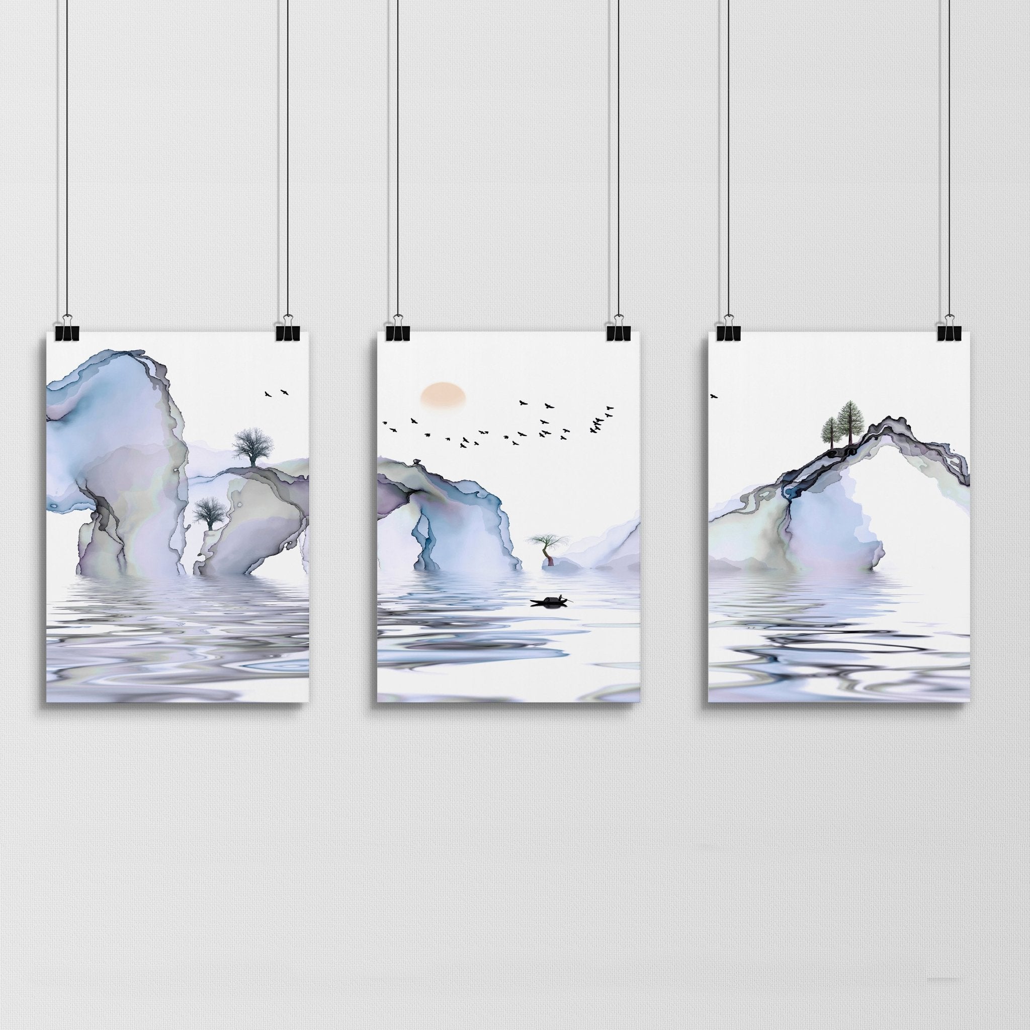 Set of 3 framed wall art prints featuring light blue ethereal Japanese landscapes, perfect for creating a serene bedroom atmosphere.