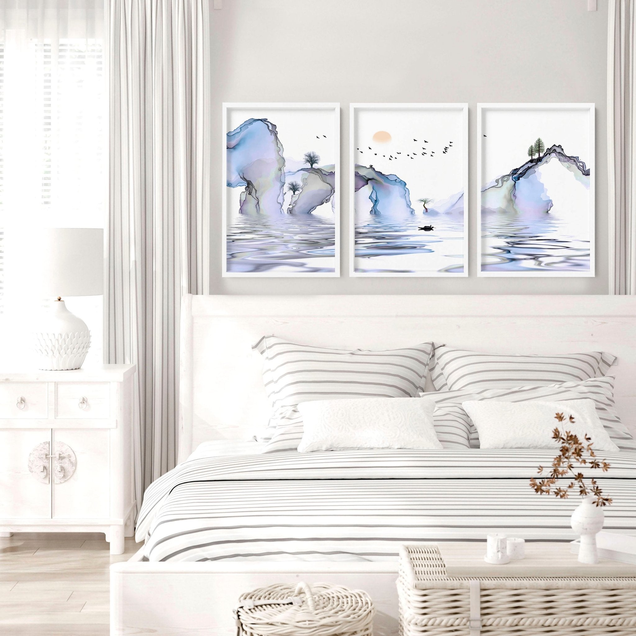 Set of 3 framed wall art prints featuring light blue ethereal Japanese landscapes, perfect for creating a serene bedroom atmosphere.