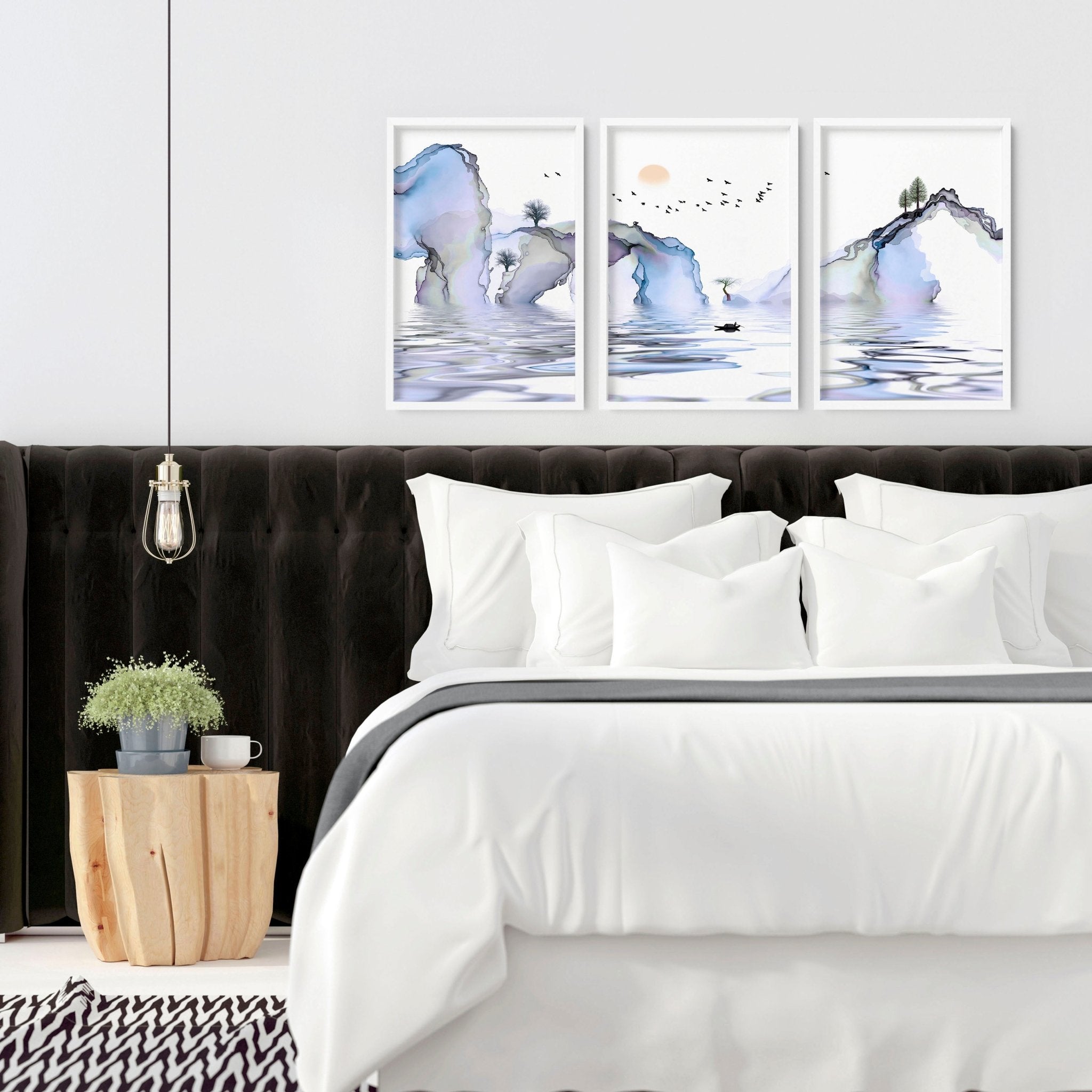 Set of 3 framed wall art prints featuring light blue ethereal Japanese landscapes, perfect for creating a serene bedroom atmosphere.