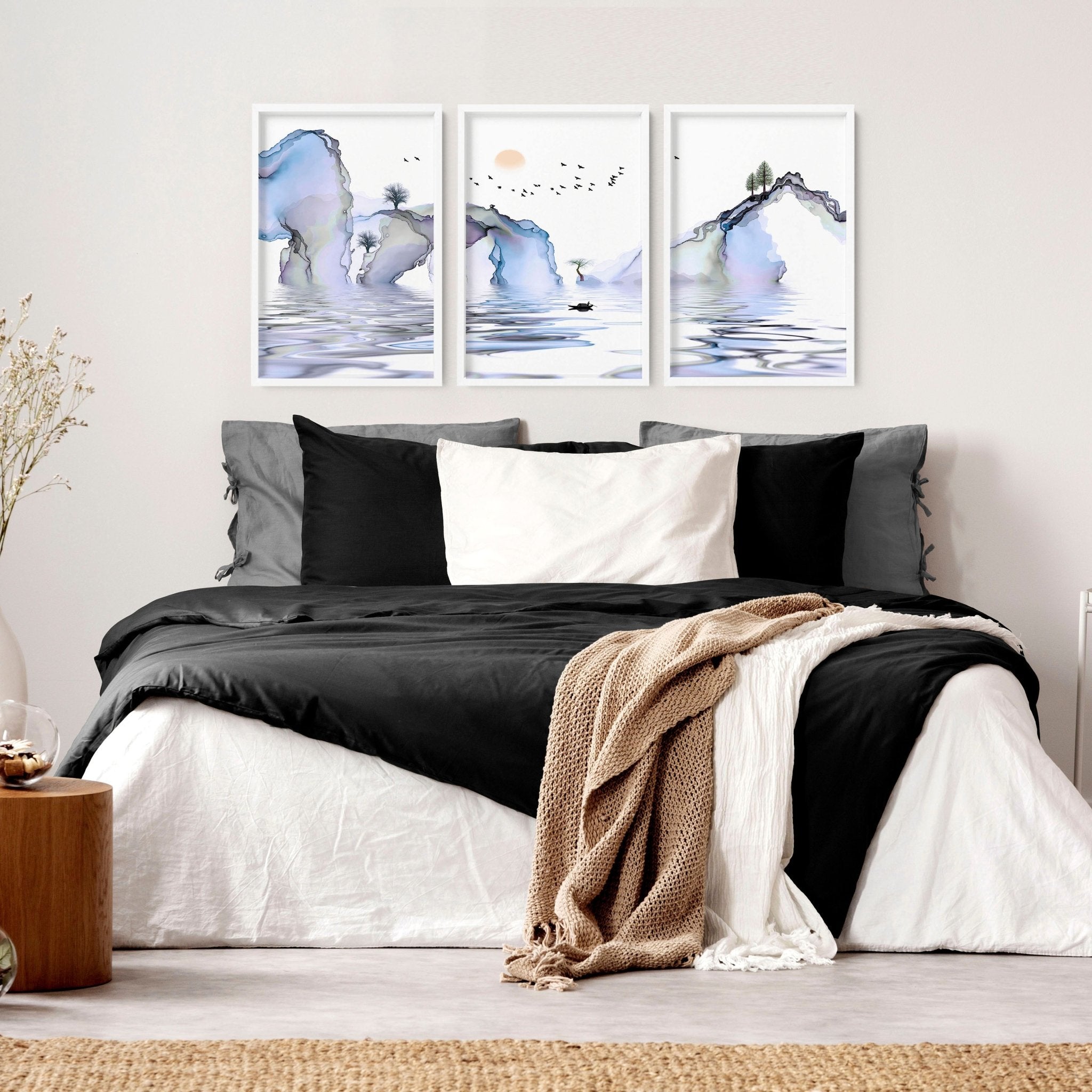 Set of 3 framed wall art prints featuring light blue ethereal Japanese landscapes, perfect for creating a serene bedroom atmosphere.