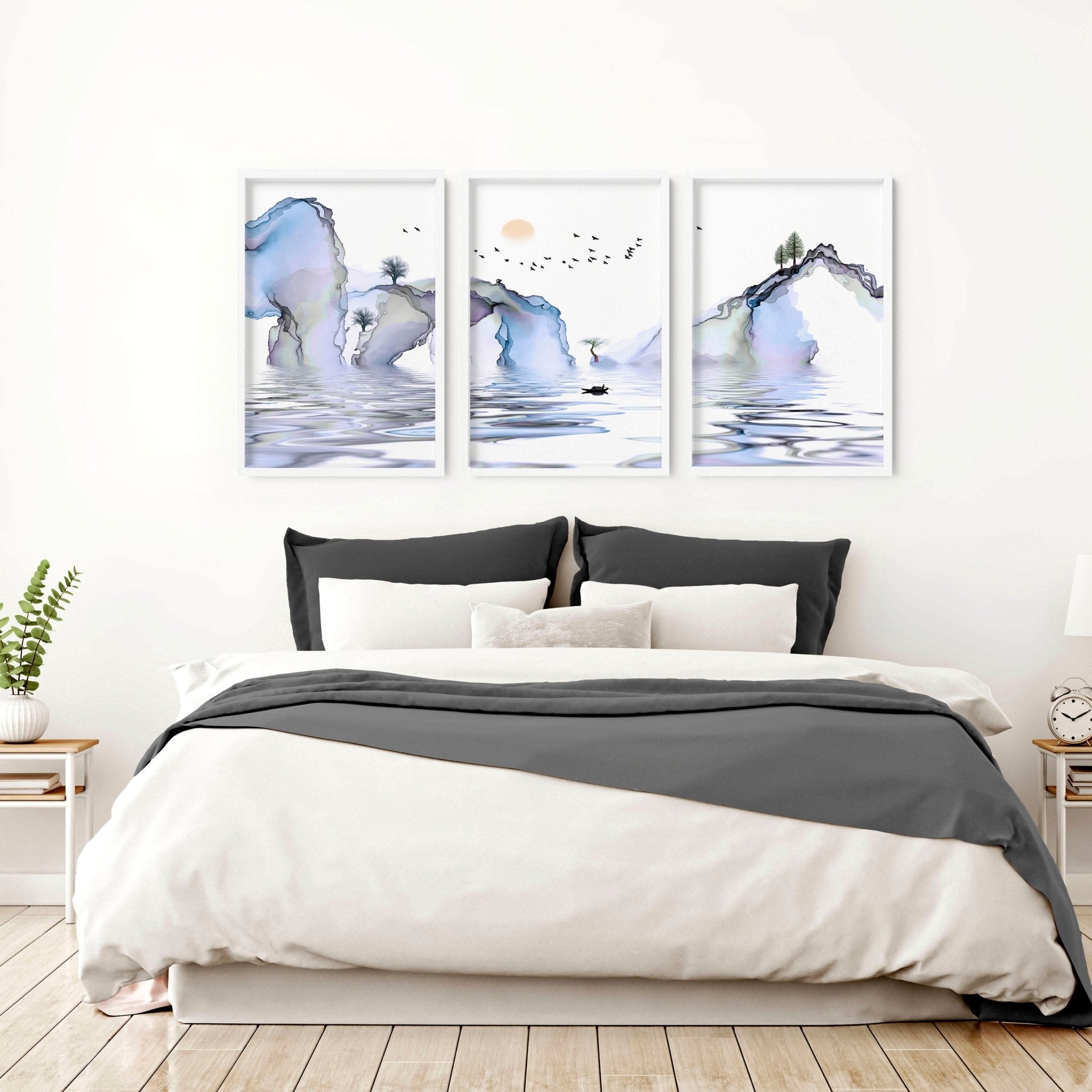 Set of 3 framed wall art prints featuring light blue ethereal Japanese landscapes, perfect for creating a serene bedroom atmosphere.