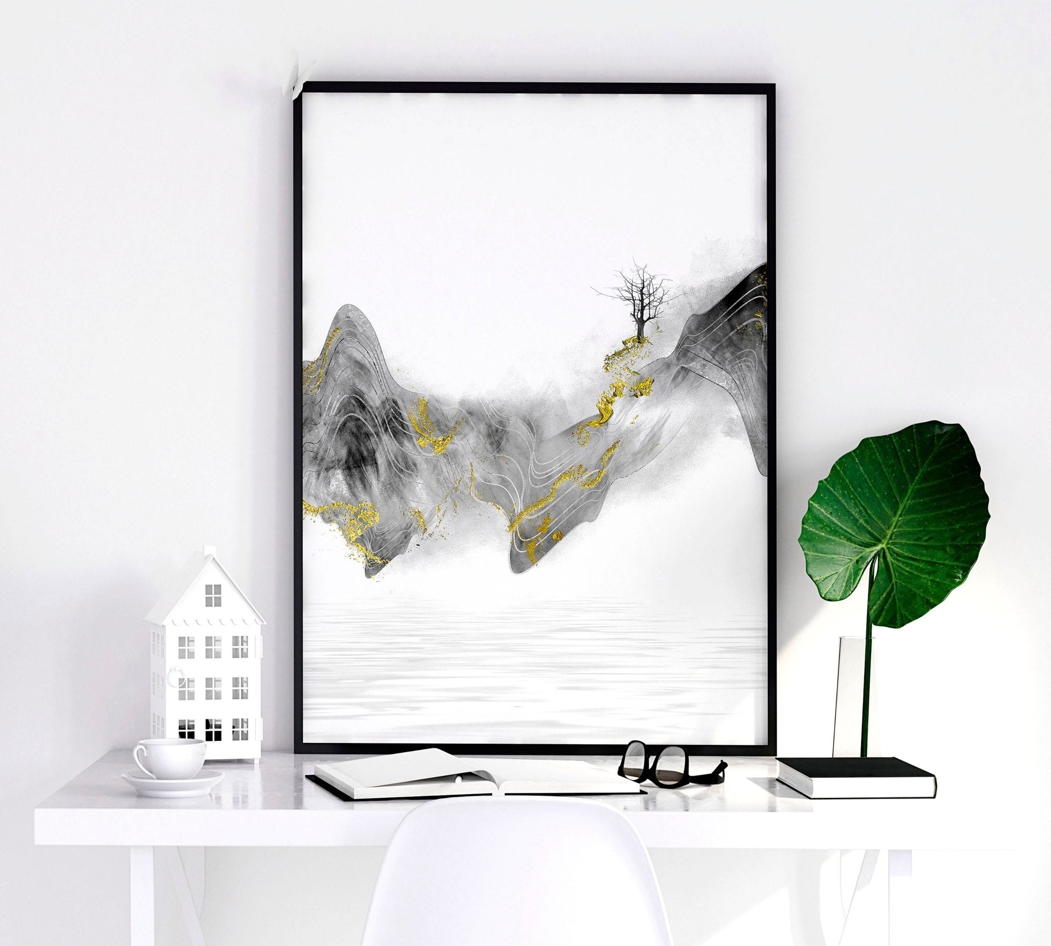 Set of 3 framed Japanese art prints featuring modern designs in grey and gold tones, elegantly displayed on a wall.