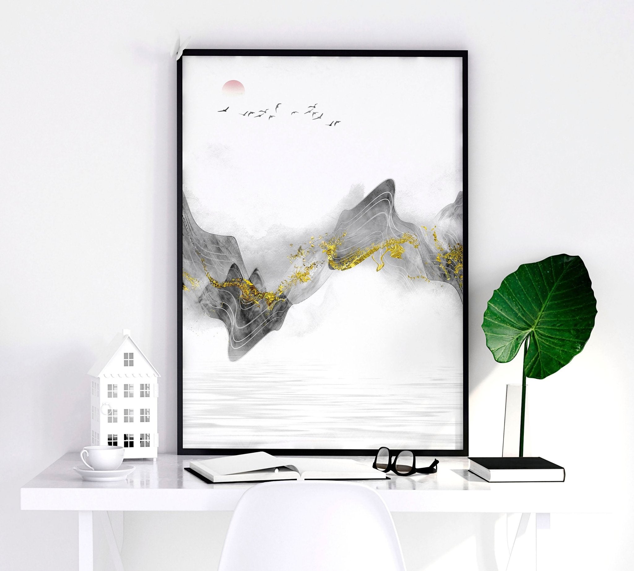 Set of 3 framed Japanese art prints featuring modern designs in grey and gold tones, elegantly displayed on a wall.