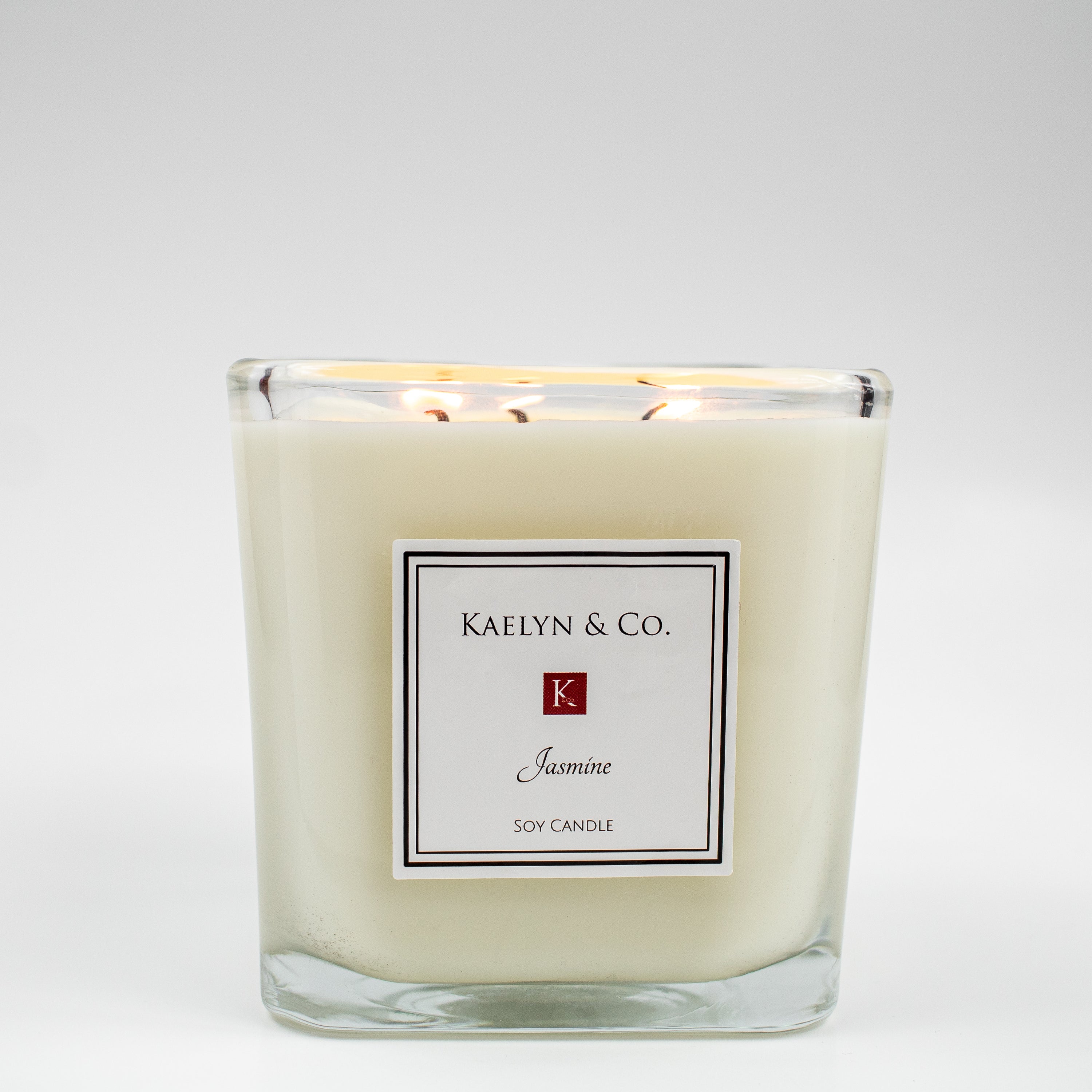 Jasmine Large Cube Candle with wild honeysuckle and jasmine fragrance, elegantly designed in a 4x4x4 inch cube shape.