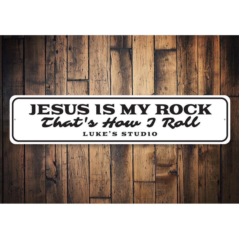 A decorative metal sign featuring the phrase 'Jesus is My Rock', showcasing a beautiful design suitable for home decor.