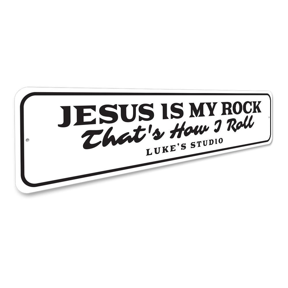 A decorative metal sign featuring the phrase 'Jesus is My Rock', showcasing a beautiful design suitable for home decor.