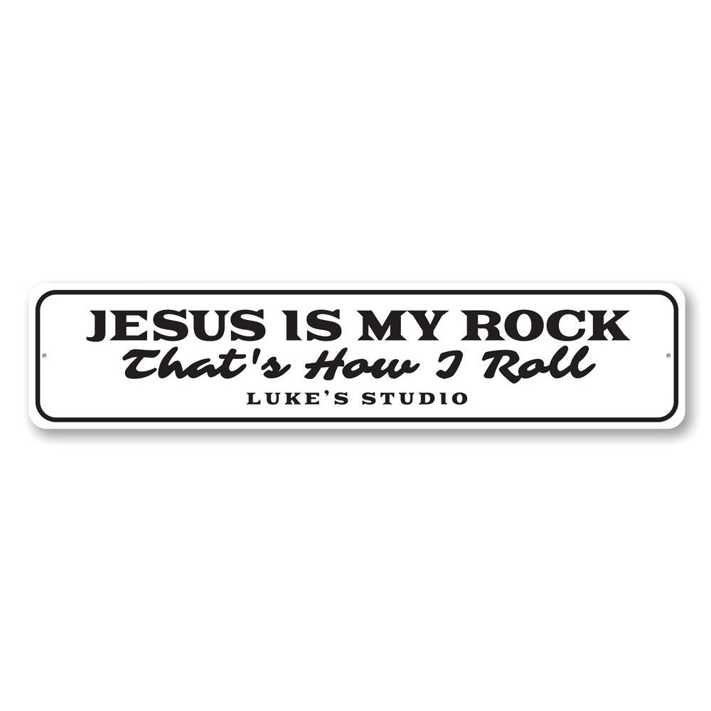 A decorative metal sign featuring the phrase 'Jesus is My Rock', showcasing a beautiful design suitable for home decor.