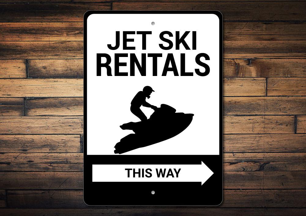 A vibrant Jet Ski Rentals This Way Sign made of durable aluminum, featuring a beach-themed design perfect for coastal decor.