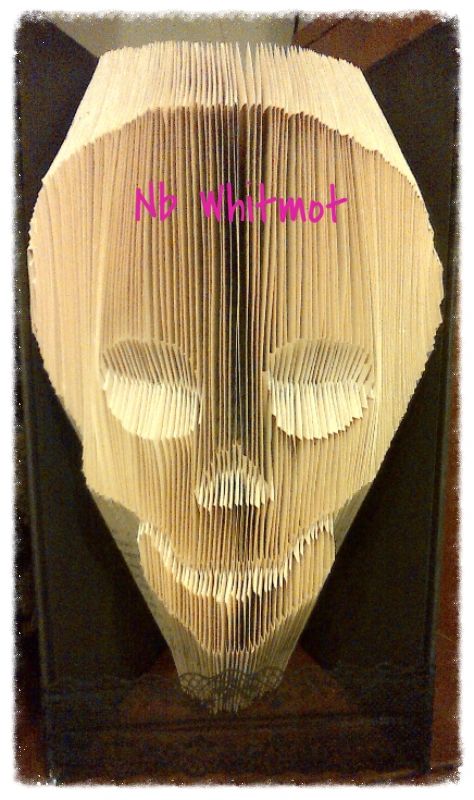 Jimmy The Skull, a unique hand-folded art piece made from vintage book pages, showcasing intricate details and craftsmanship.