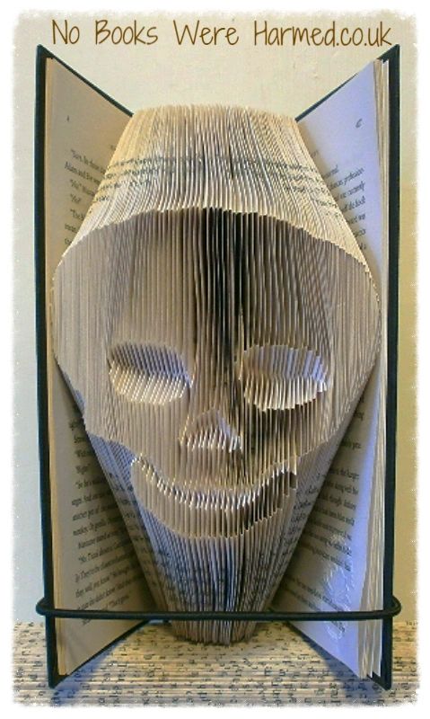 Jimmy The Skull, a unique hand-folded art piece made from vintage book pages, showcasing intricate details and craftsmanship.