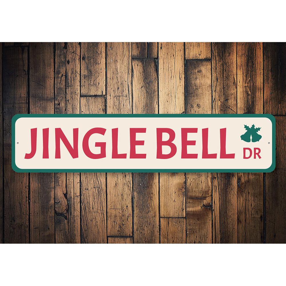 Jingle Bell Drive Holiday Sign featuring festive colors and charming design, perfect for Christmas decorations.